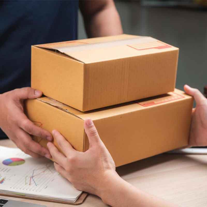 A logistics professional reviewing data on a tablet.